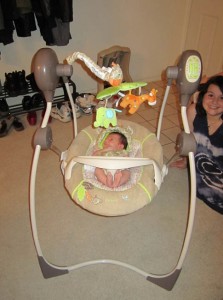 In his new swing. Cousin T helped put it together.