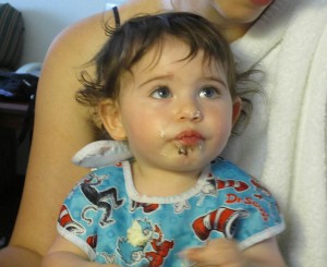 DJ's first cupcake for his first birthday party with family.