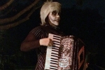 Our neighbor as the Pumpkin King (Queen?) entertaining the neighborhood with spooky music.